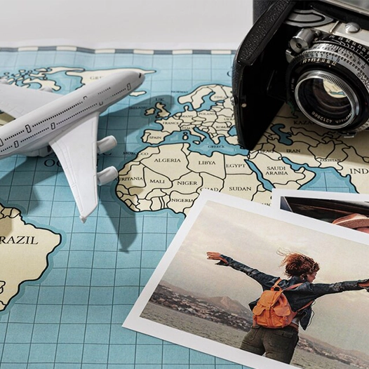 A map, camera, and airplane, symbolizing a successful journey with Migration service providers in Kerala.